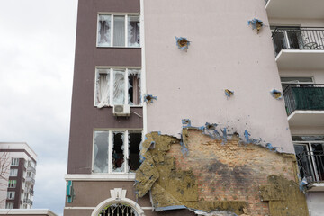 2022 Russian invasion Ukraine war Bucha destroyed building destruction wall hole shot Irpin...