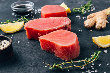 Raw tuna fillet steak with thyme, lemon and ginger.