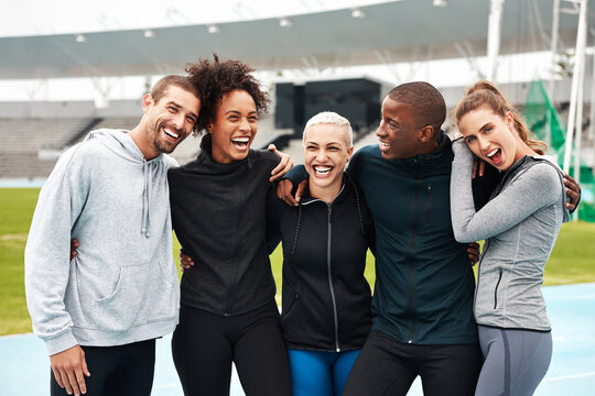 We Make The Best Team. Cropped Portrait Of A Diverse Group Of Athletes Standing Together And Smiling After An Outdoor Team Training Session.