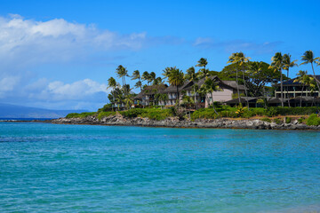 Luxury resort surrounded by palm trees in Napili Bay in Kapalua in the West of Maui island, Hawaii, United States