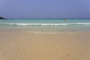 Fototapeta na wymiar beach and sea wave on the white sand beach and space on blue sky on sunny day