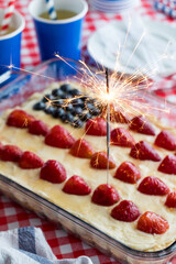 A cheesecake tart with American flag design for 4th of July celebration.