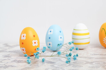 Easter. Multicolored eggs. Yellow and blue Easter decorations.