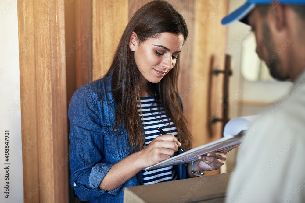 Poster i just need your signature please. cropped shot of a courier making a delivery to a customer at her 