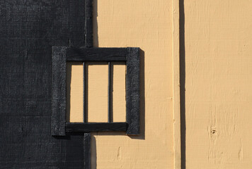 Wooden window frame geometric abstract with square and lines in black and brown