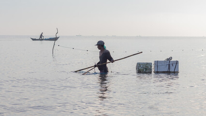 Shrimp fisherman carrying catch with Styrofoam