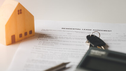 Residential lease agreement document concept. Lease agreement document with keys and house, house ,...