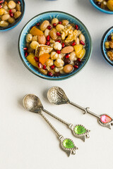 Traditional Turkish Dessert Ashure or Noah's Pudding in stylish bowl on white surface.Turkish Cuisine