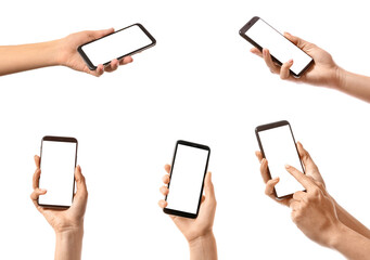 Obraz na płótnie Canvas Set of hands holding smartphones with blank screens isolated on white. Mockup for design