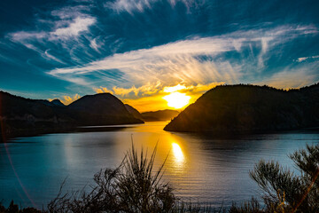 beautiful sunset in the middle of mountains at Lake Lácar in San Martín de los Andes, Argentina