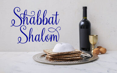 Plate with matza, kippah and wine on table. Shabbat Shalom - obrazy, fototapety, plakaty