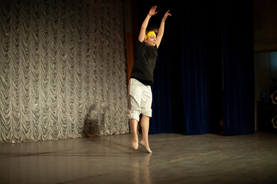 Dancer on stage. Ballet teacher. Expression of emotions in motion. Choreography lesson.