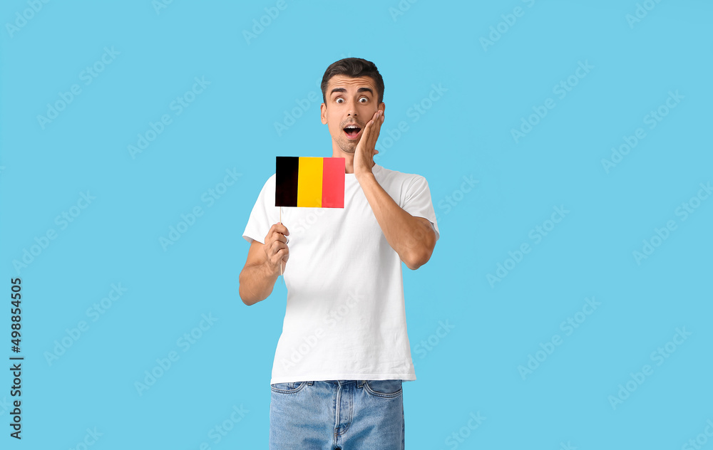 Sticker shocked man with flag of belgium on color background