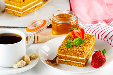 Tasty dessert honey cake. Slice of sweet homemade layered honey cake.