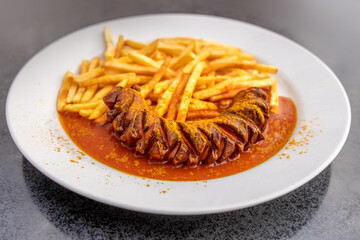 German Junk Food Dish Currywurst  with French Fries