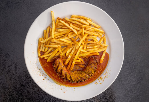 German Junk Food Dish Currywurst  with French Fries