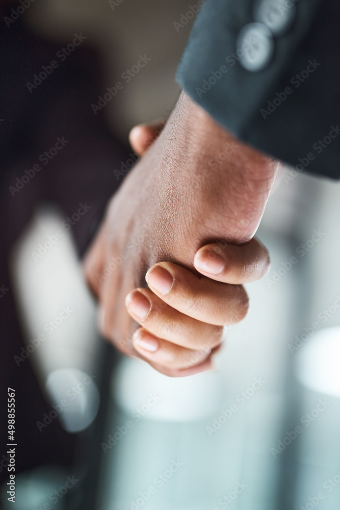 Poster this is the real contract. cropped shot of two unrecognizable businesspeople shaking hands in an off