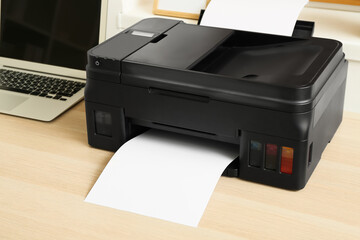 Printer with paper on table, closeup
