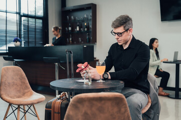 Young businessman waiting for his flight in the lobby area.