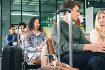 Women is waiting for a flight in the lobby area.