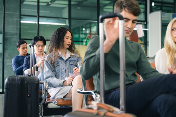 Women is waiting for a flight in the lobby area.