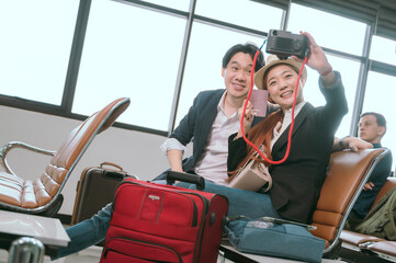 Couple posing for a photo while waiting for their flight in the lobby.