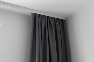 abstract grey color curtains at home on white railings