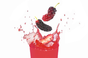 Glass of red mulberry juice splash isolated on white background.
