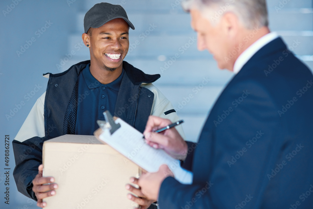 Poster just a signature and its all yours. cropped shot of a courier making a delivery to a businessman at 