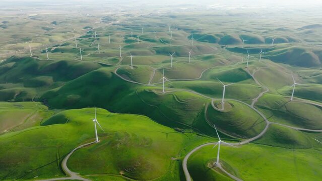 Power generation by wind turbines, epic aerial view on large sustainable energy