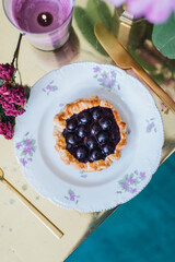 mini blueberry pie on a plate galette tart