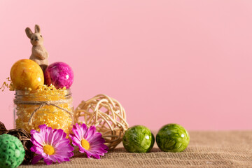 A few Easter eggs scattered on linen fabric As an Easter decoration.