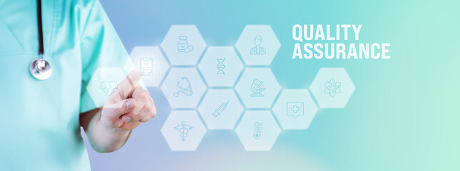 Quality assurance (QA). Male doctor pointing finger at digital hologram made of icons. Text with medical term. Concept for digitalization in medicine
