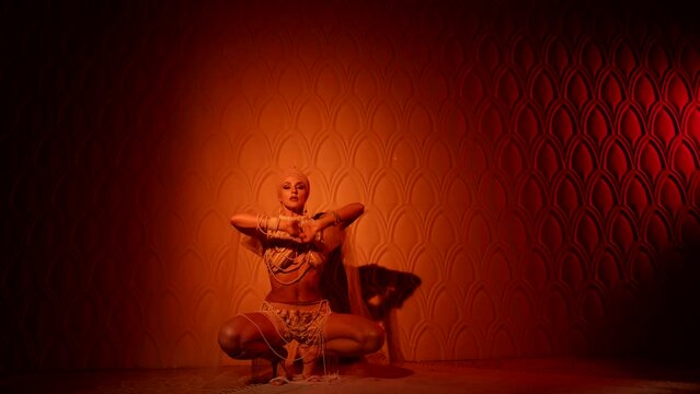 sexual fantasy about arabian concubine in harem in ancient palace, lady is dancing seductively