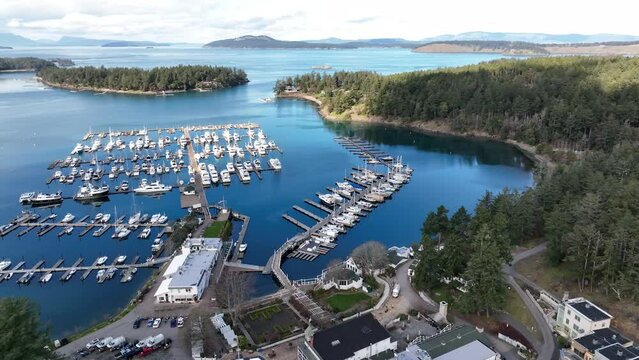 Cinematic 4K aerial drone pan shot of Haro Strait and Roche Harbor and resort, a sheltered harbor and protected anchorage on San Juan Island, Washington state