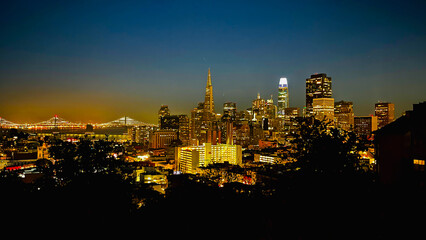 San Francisco high rise and the Bay Bridge at night, California, USA