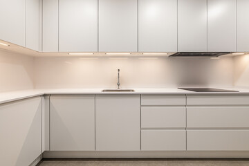 White empty classic kitchen in front view in new or refurbished apartment