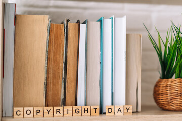 Word copyright day made of letters in front of books.