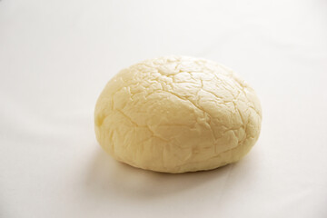 Japanese Pastry: white bun filled with whipped cream and red sweet bean, like Daifuku