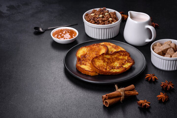 Cereal with chocolate, milk and bread in an egg against a dark concrete background