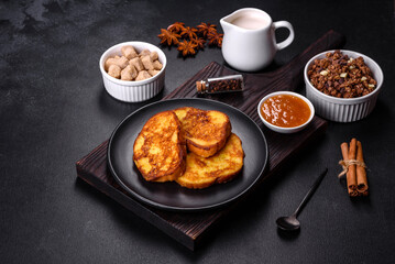 Cereal with chocolate, milk and bread in an egg against a dark concrete background