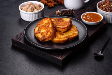 Cereal with chocolate, milk and bread in an egg against a dark concrete background