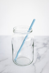 upcycled glass jar with silicon straws instead of plastic container and straws, zero waste and environmentally conscious choices