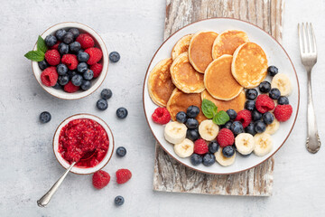 Keto diet pancakes made or almond flour, served with berries.