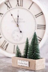 Christmas clock with winter decoration. Happy new year concept