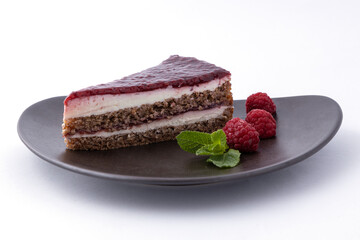 Slice of delicious raspberry cake, decorated with raspberries