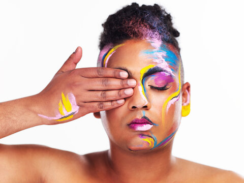 How you identify is your decision and no one elses. Cropped shot of a gender fluid young man wearing face paint against a white background. - Powered by Adobe