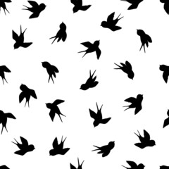 Obraz na płótnie Canvas Seamless pattern with black swallow silhouette on white background. Cute bird in flight. Vector illustration. Doodle style. Design for invitation, poster, card, fabric, textile