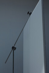 c stand with grey background on a photo studio