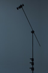 c stand with grey background on a photo studio